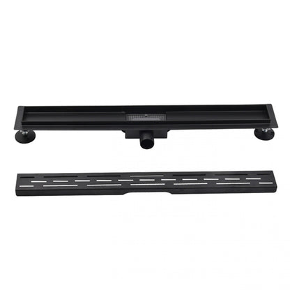 Zwarte douchegoot met afneembare sleufroosterafdekking en verstelbare poten voor waterafvoer in de douchevloer.